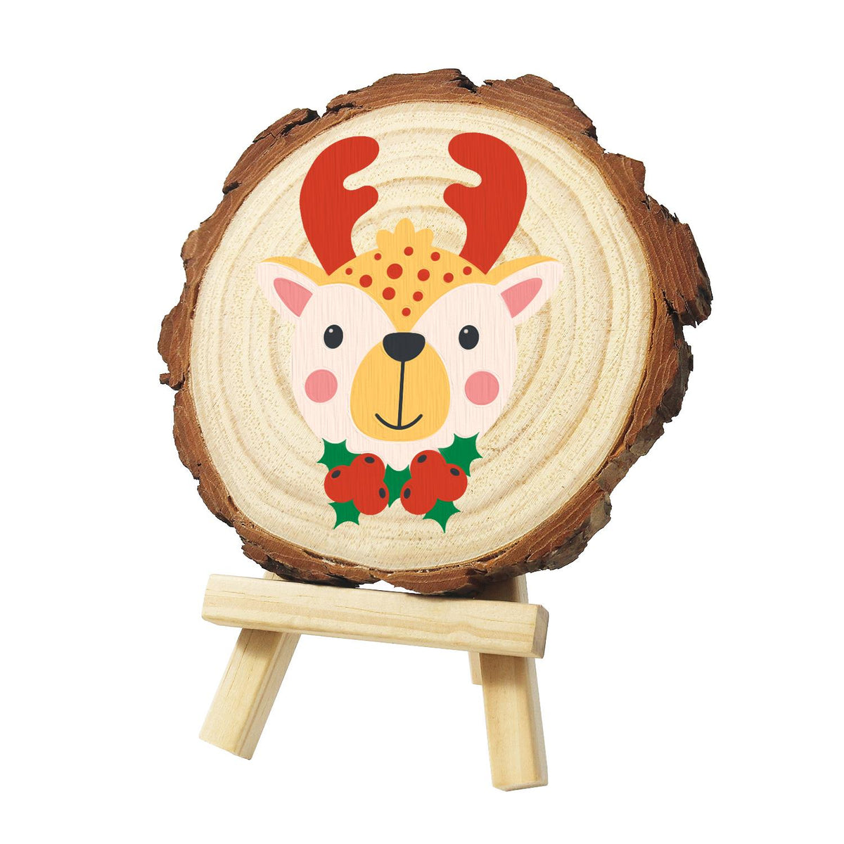 Red-Antlered Reindeer with Holly paint by numbers wood slice – Pink reindeer face with red antlers, a yellow polka-dot tuft and holly with red berries at its neck, painted on a pine slice on a small easel