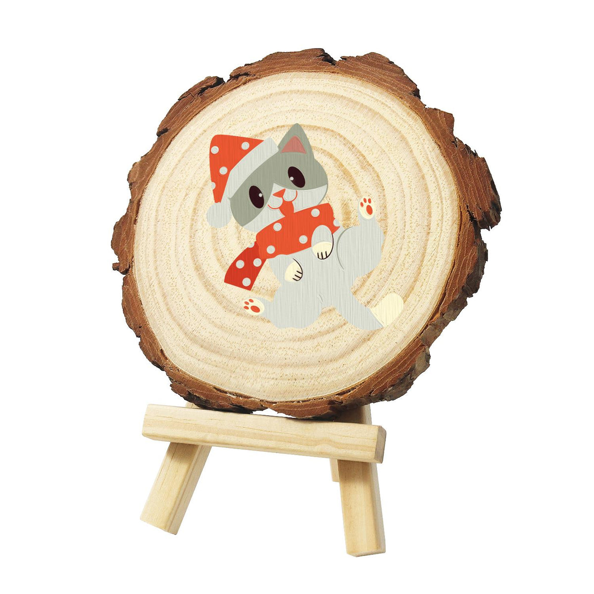 Polka-Dot Santa Hat Cat paint by numbers wood slice – Grey cat rolling on its back in a red polka-dot Santa hat and matching red polka-dot scarf, painted on a pine slice on a small easel