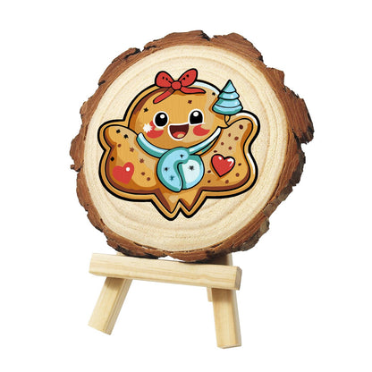 Gingerbread Sweetheart Cookie paint by numbers wood slice – Beaming gingerbread cookie with a red bow, light blue scarf, red hearts and a tiny blue tree by its head, painted on a pine slice on a small easel