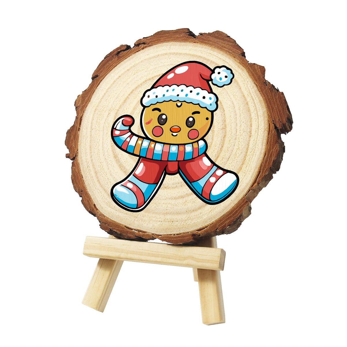 Winking Gingerbread Boy paint by numbers wood slice – Winking gingerbread boy in a red Santa hat with a long striped scarf and red and blue striped legs, painted on a pine slice on a small easel