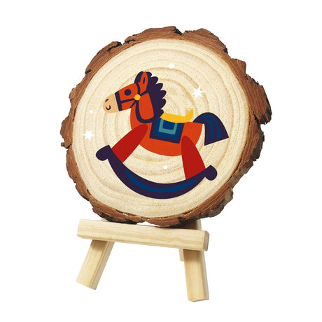 Red Rocking Horse with Blue Saddle paint by numbers wood slice – Red rocking horse with a dark blue mane, blue saddle on a yellow pad and navy rockers, with sparkles, painted on a pine slice on a small easel