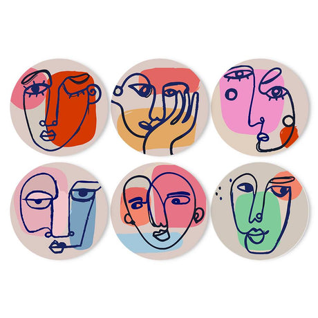 Blush Line-Art Faces paint by numbers placemat set – Abstract one-line faces drawn in navy over pastel pink, orange, blue and green colour blocks